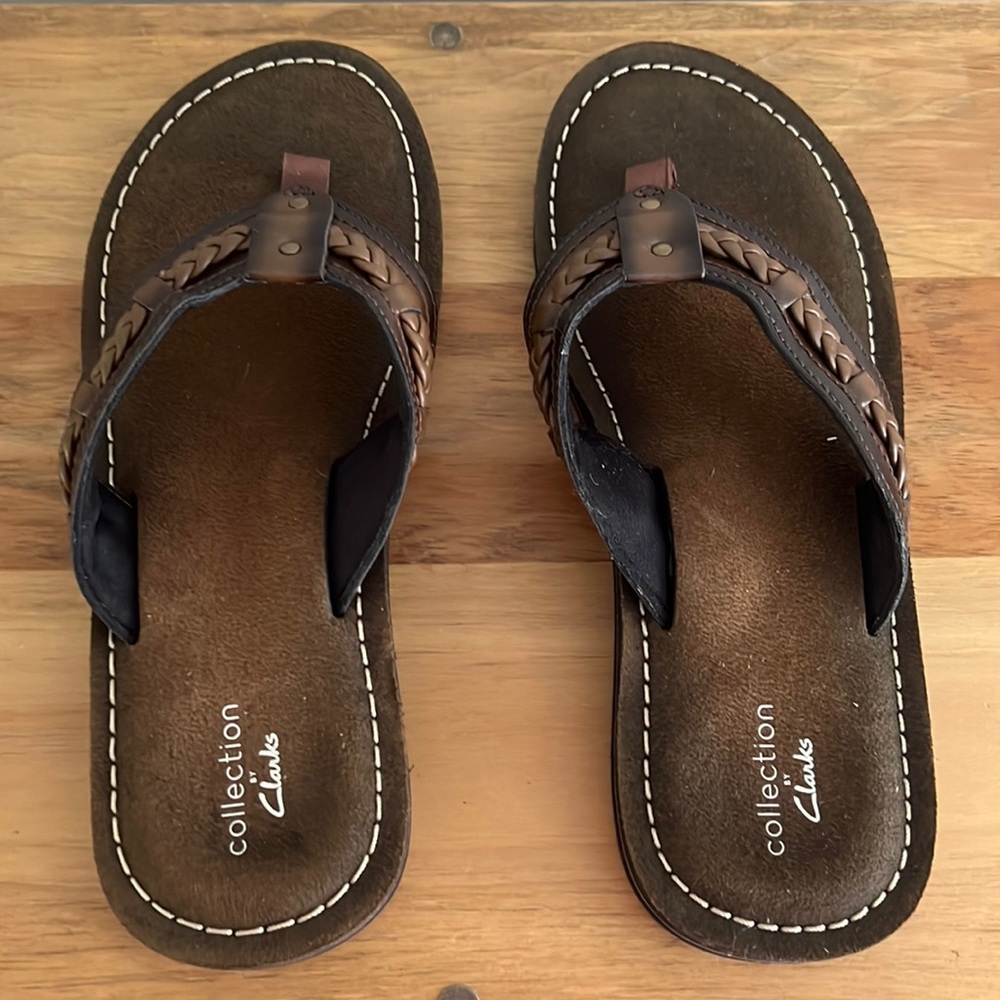 New without tags never been worn brown leather strap Clark’s flip flops